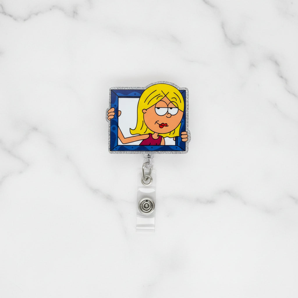 Lizzie holding a blue picture frame 